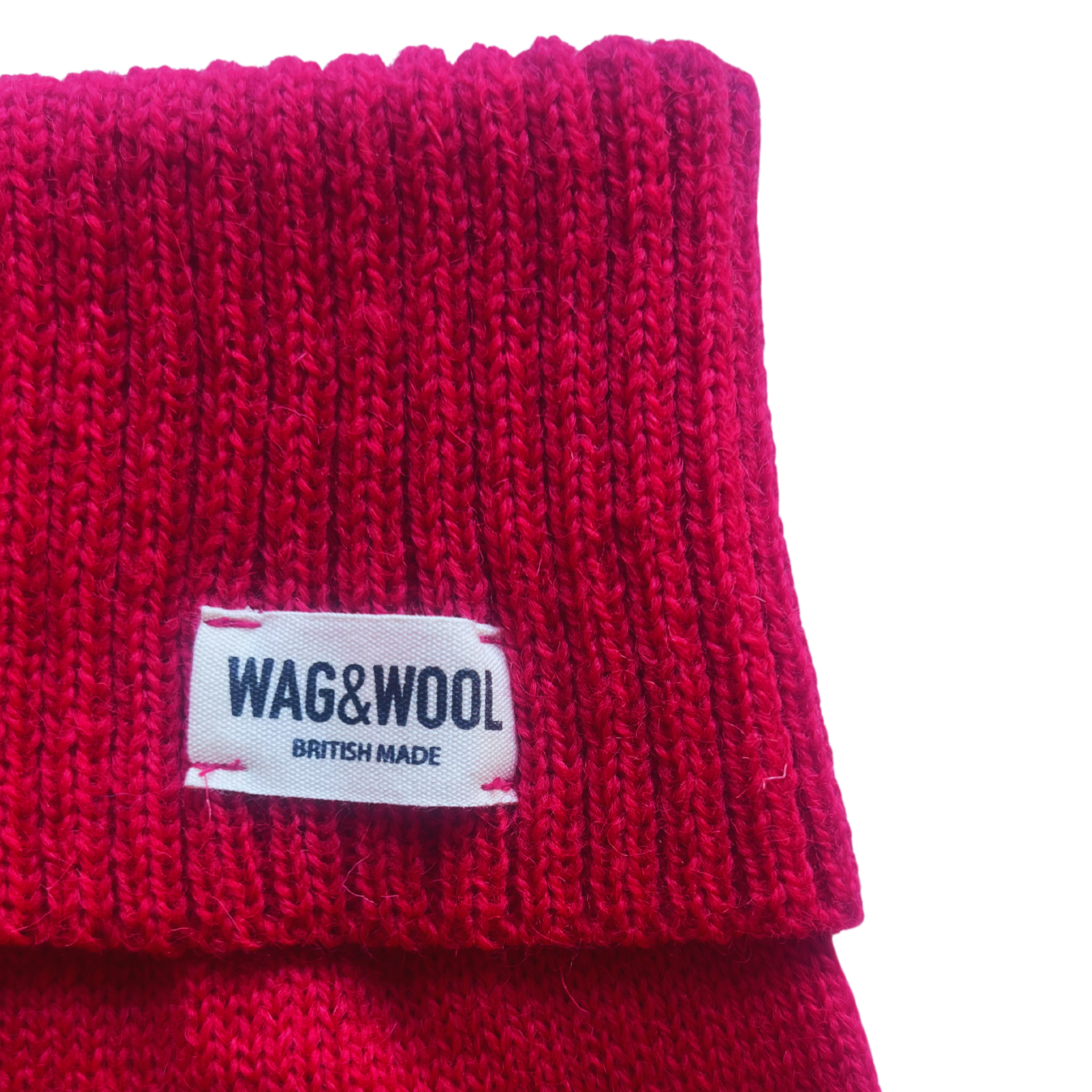 Cherry red dog jumper label close-up